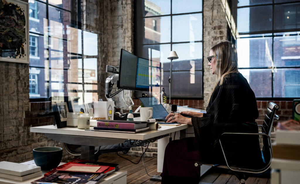 Woman working on her computer in an office